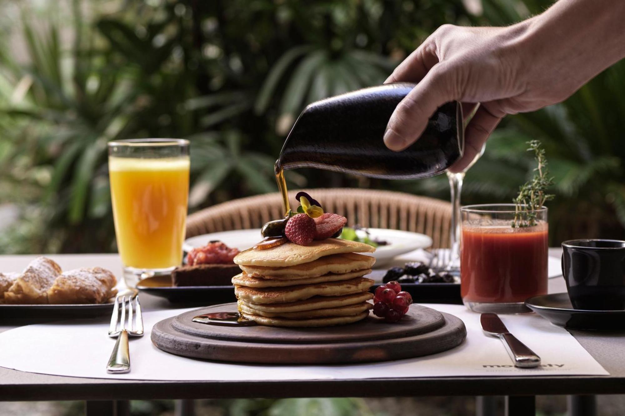 Hotel Monasty, Thessaloniki, Autograph Collection Zewnętrze zdjęcie Maple syrup being poured on a stack of pancakes